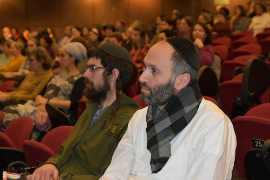 Conference participants listening to the opening session. 